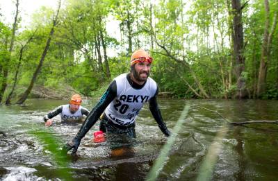 Racers leave the river of doom. Think our faces probably looked a bit like this too! Photo credit: Johan Valkonen