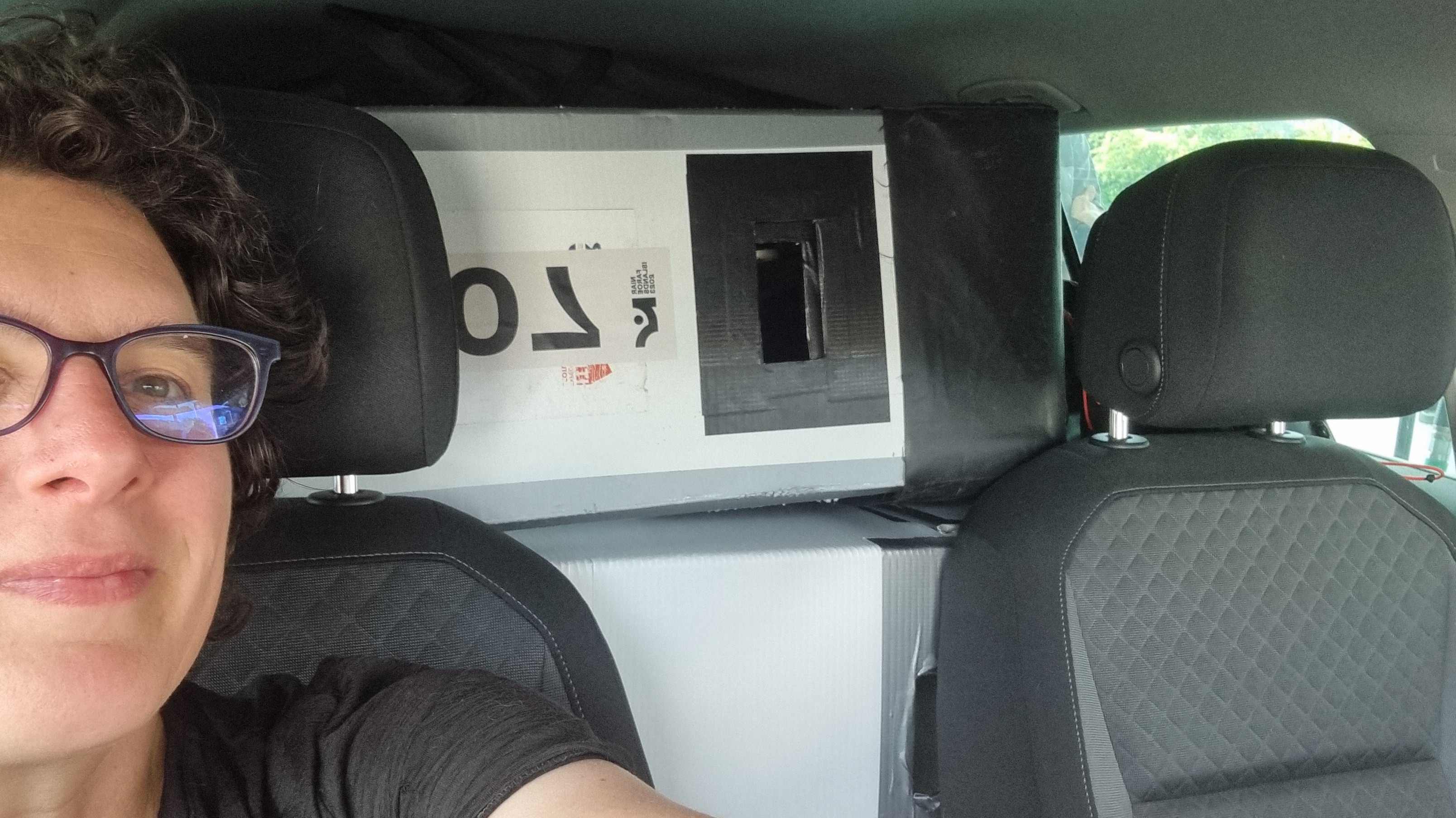 Me in the car before we left, the car is rammed to the roof with bike boxes and kit