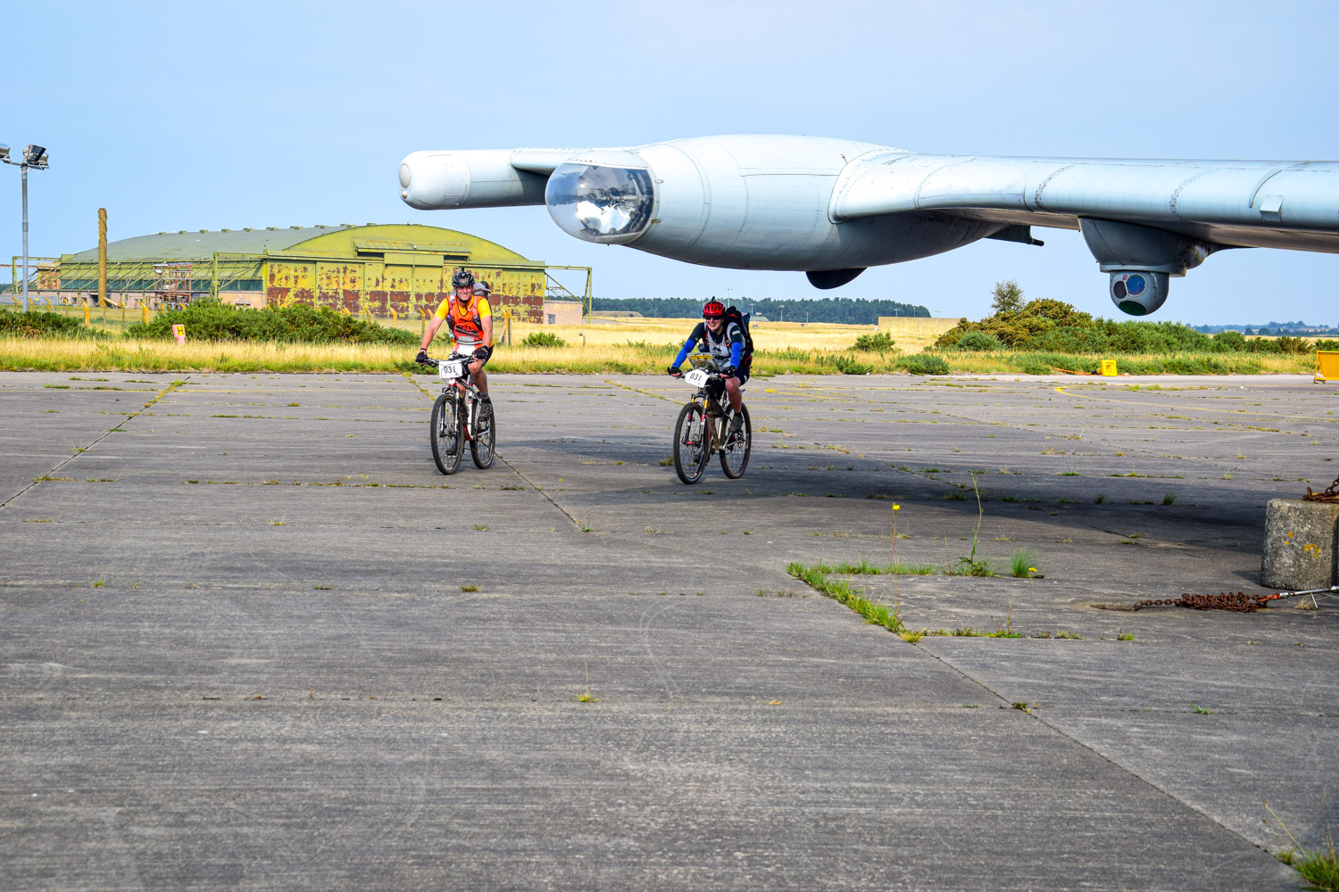We are riding round / under the aircraft wing to get to the control